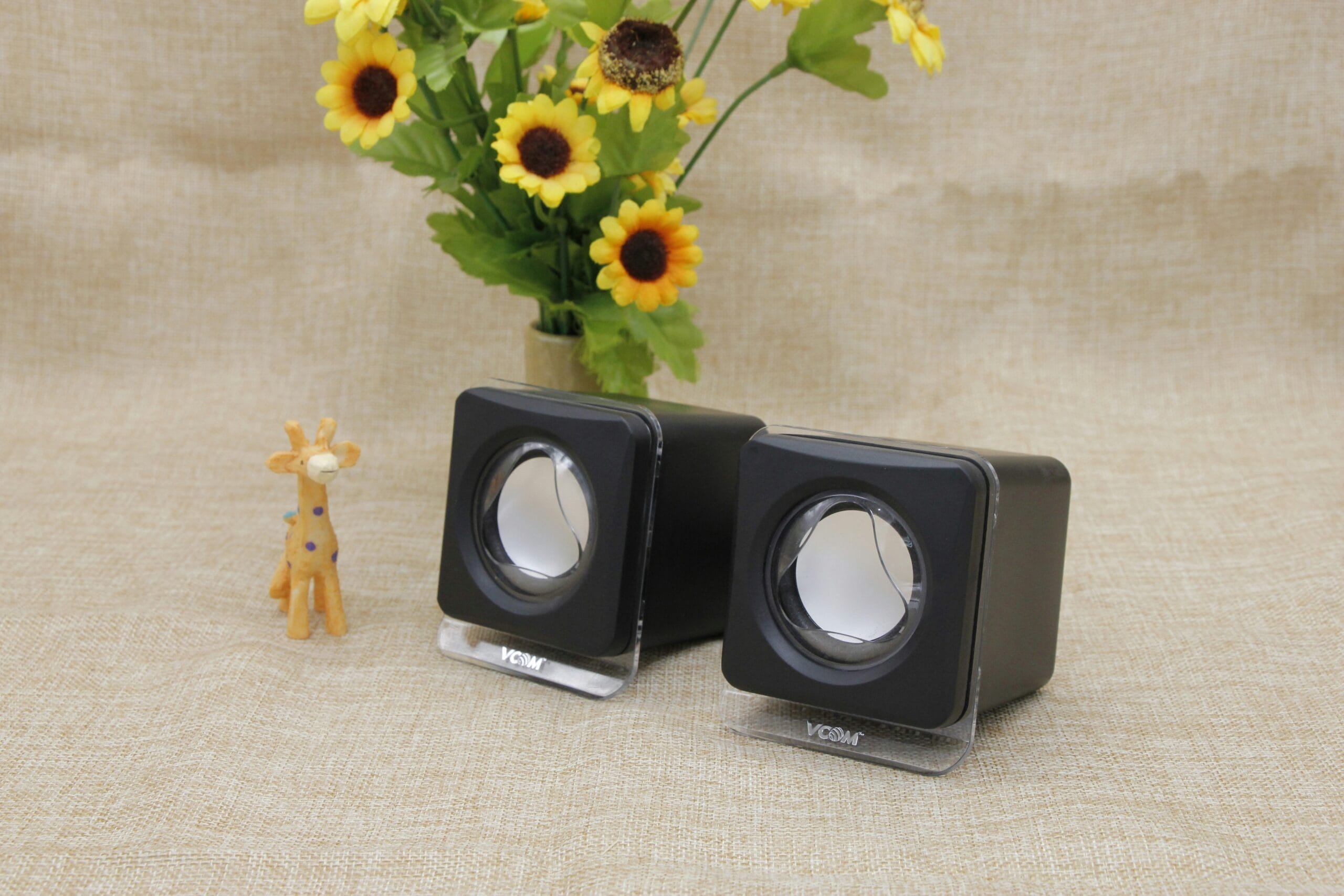 A couple of speakers sitting on top of a table