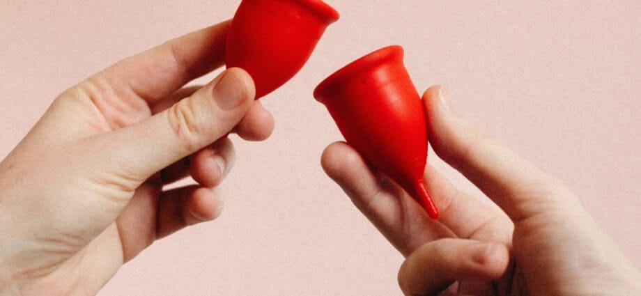 person holding red heart shape ornament