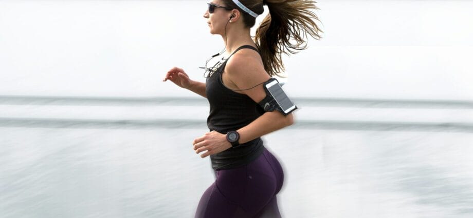 woman running wearing armband